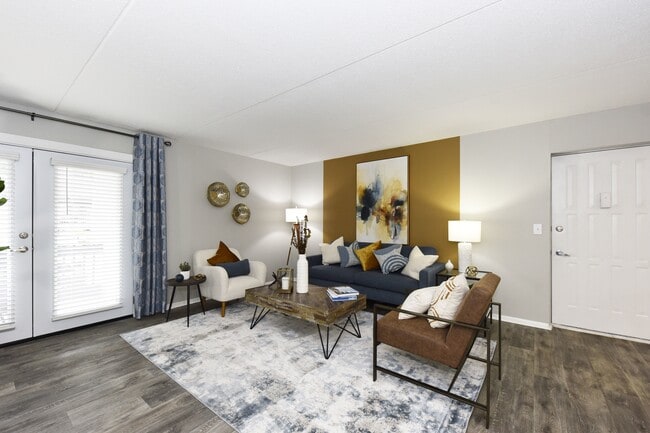 Spacious Living Room + Oversized Windows - Revere at Hamilton Place Apartments