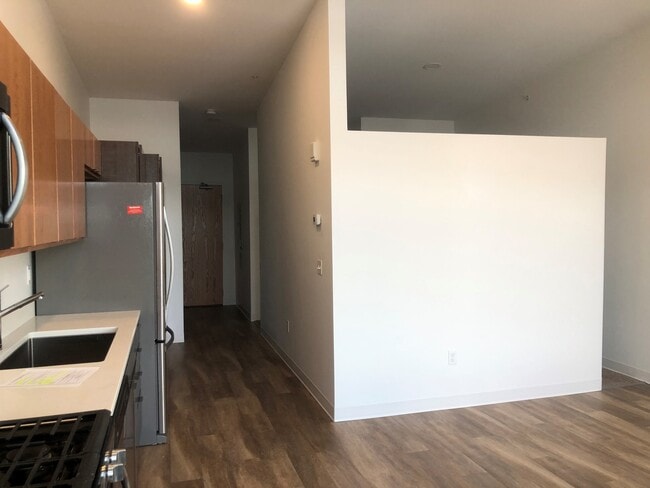 Kitchen View to Entry Door and Bedroom