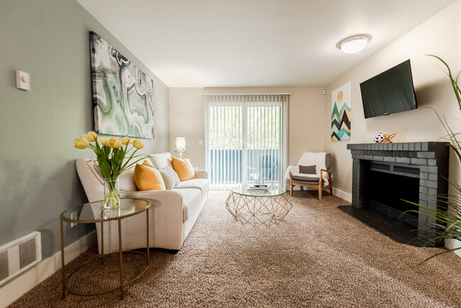 Kent Apartments - Vibe Apartments - Living Room, Deck, and Fireplace - Vibe Apartments