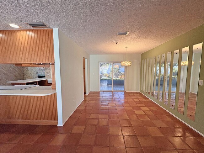 Photo - 3 Bed 2 Bath Home with Large Fenced Backyard & Screened Lanai — Available Now