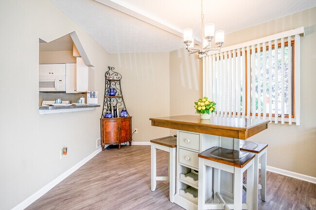 Dining Area with Pass-Through / Breakfast Bar in Townhome