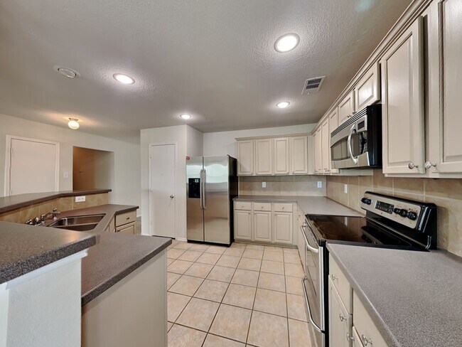 Photo - Liberty Crossing Beauty with Space to Spare, a Gameroom to Love & Entertaining Made Easy!
