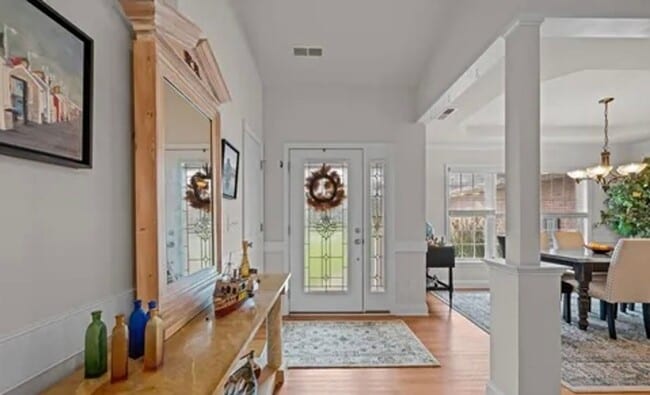 Photo - **Stately Brick Home in Fairfield Harbour | Tray Ceiling, Column, Bonus Room & Screened Porch**