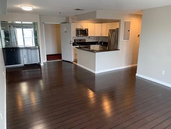 Main living space (open concept combining living room, dining room, kitchen, bar) - 500 Washington St Unit 502