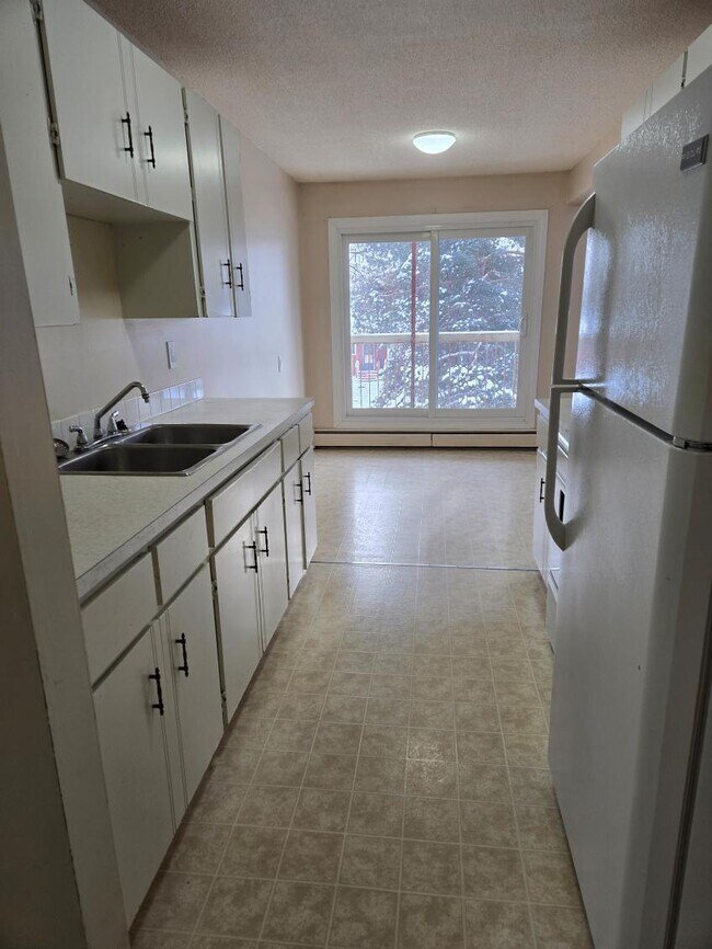 Building Photo - 4507-244 44 Ave Unit 207