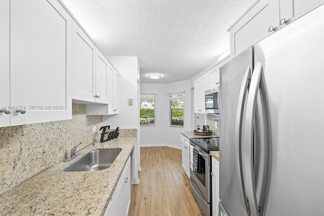 Building Photo - 1401 SW 128th Terrace Unit 103H