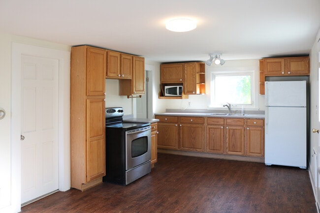 Open concept kitchen/living area with new flooring. - 34A Royal Ave Unit 34A Royal Ave