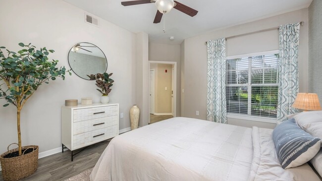 Step into the sun-kissed haven of our generously sized guest bedroom, featuring a magnificent double window that welcomes the radiant Florida sunshine. Bask in the pure pleasure of your daily retreat.