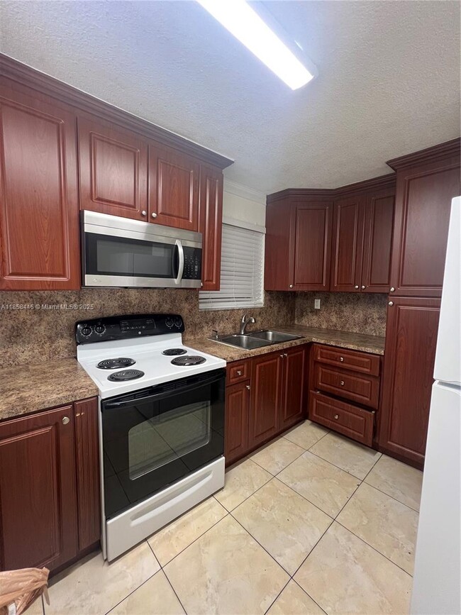 Building Photo - 3501 W 11th Ave Unit 208 Rental