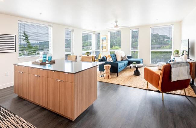 Large living room with an abundance of natural light,!