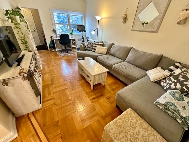 Big Living Room with lovely archway moldings and handsome wood floors. - 16 Micieli Pl Apartments Unit 2