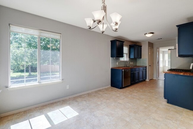 Photo - Charming 3BR / 2BA Rental with Fenced Yard & Covered Deck