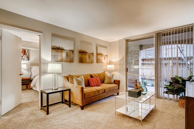 Light and bright living rooms with patios - Towne Plaza Apartments