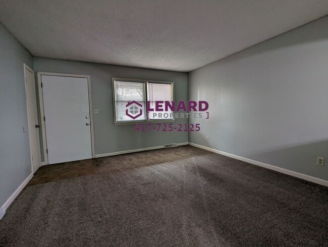Photo - Charming 3-Bedroom Home with Fenced Yard & 2-Car Garage in Springfield
