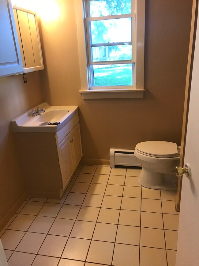 Freshly painted bathroom with connections to your very own washer and dryer.