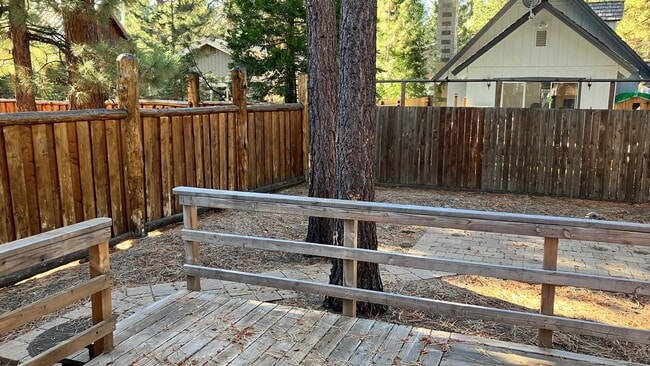 Photo - Large home with garage and fenced backyard