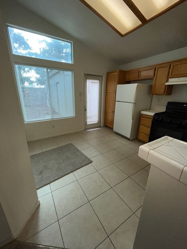 Photo - 3 Bed| 2 Bath | 1215 SF | Private Driveway + Garage | Single Story| Tenant pays $175 monthly for ...