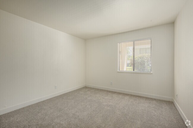 2BR, 1BA - 872SF - Primary Bedroom - Lakeside Village