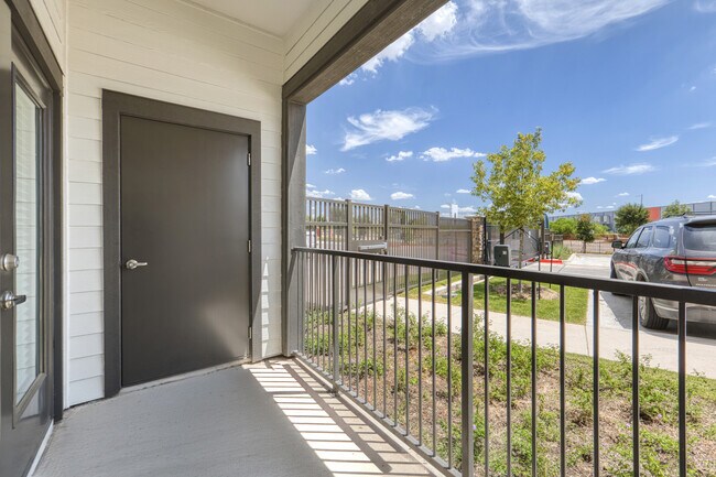 Private balcony offering a comfortable outdoor space at Sageland Flats at Brooks