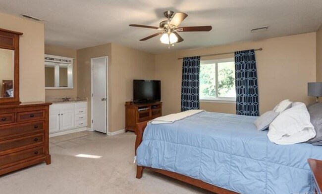 master bedroom on back of house with 2 walk in closets
