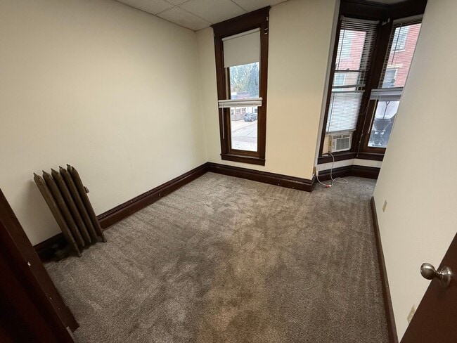 Building Photo - Spacious 4-Bedroom Apartment with Main Street Views