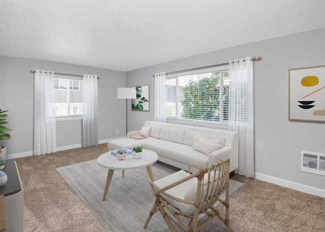 Living room with large windows allowing for abundant natural light
