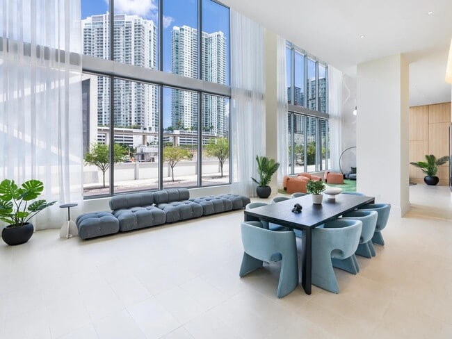 Expansive windows and chic seating make Modera Riverside’s lobby lounge a welcoming retreat in downtown Miami.