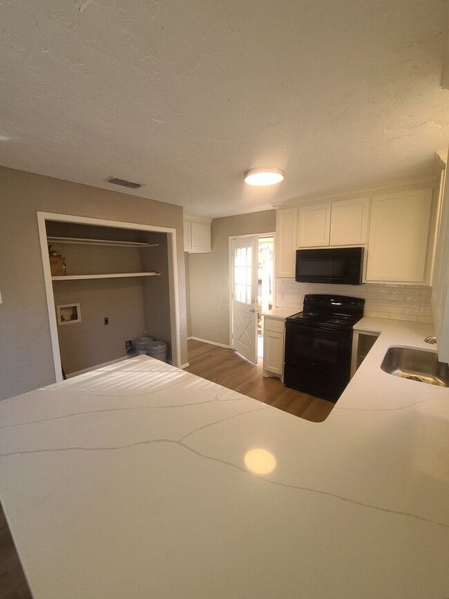 Photo - 2/1.5 covered parking, fireplace