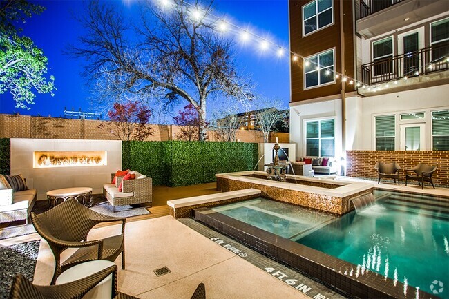 Main courtyard features a boutique, infinity-edge saltwater pool and outdoor fire place - Stella Apartments