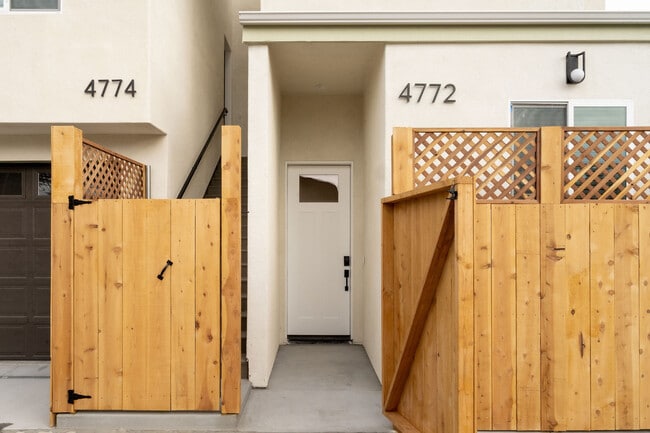 View of front door and private garage space - 4772 Bancroft St