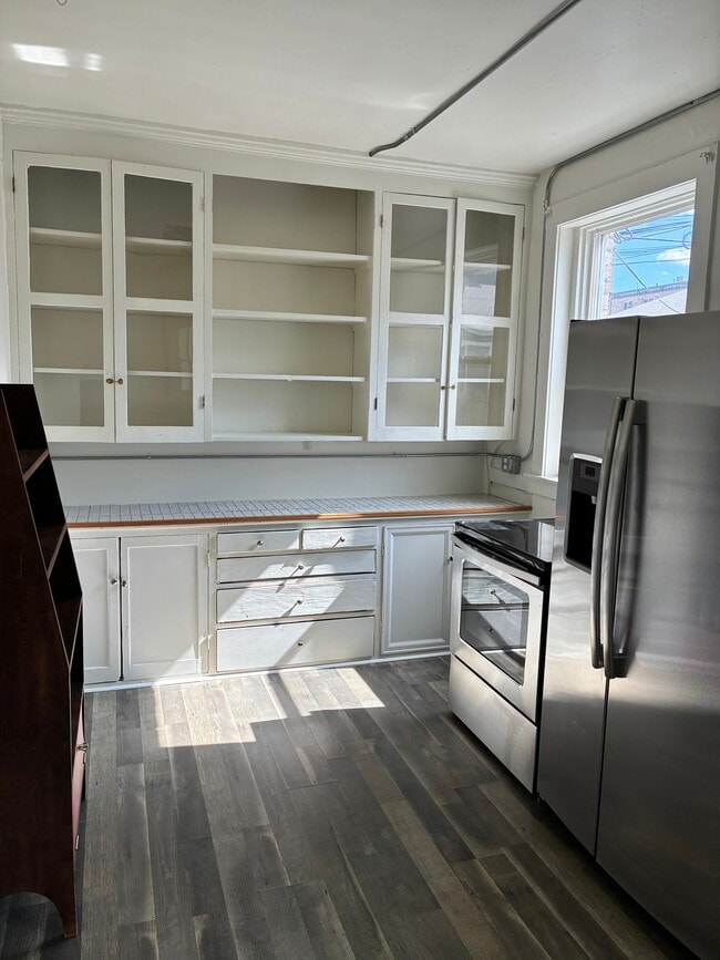 one end of kitchen-dishwasher - 212 E 3rd Ave