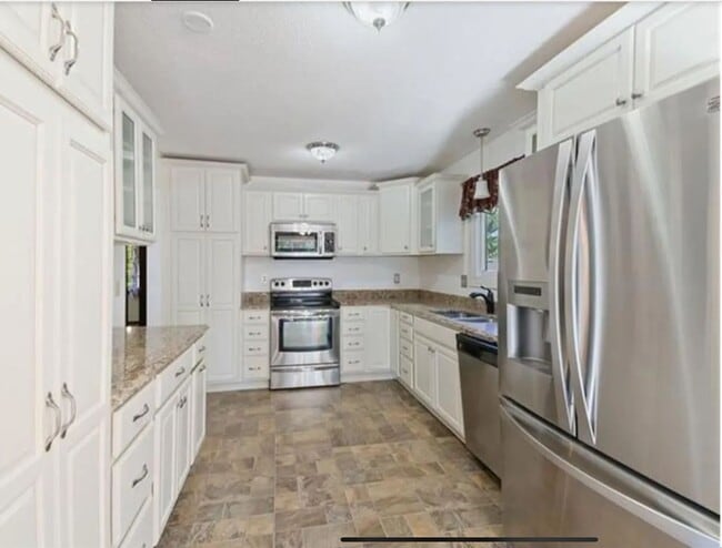 Photo - Spacious 3 bedroom home with a large Yard. Come see for yourself!