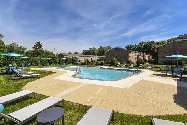 Outdoor pool with umbrellas and lounge chairs