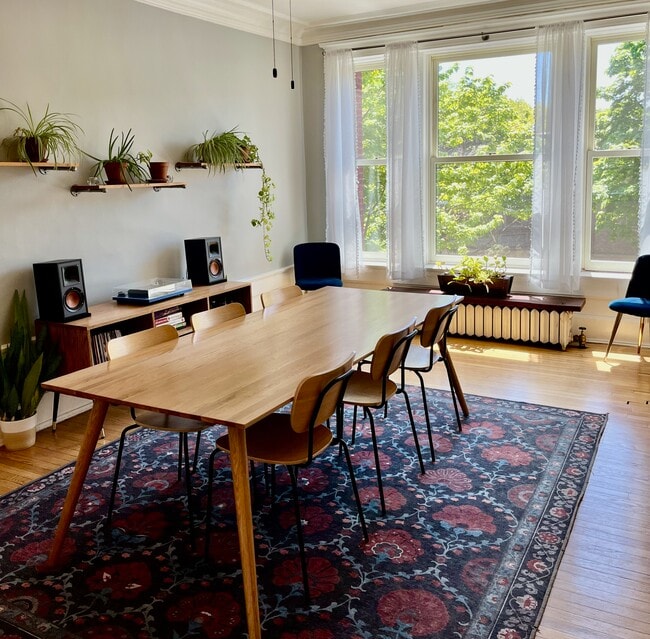 The dining room is spacious and filled with natural light from south-facing windows. - 5142 S Greenwood Ave Unit Apt 2