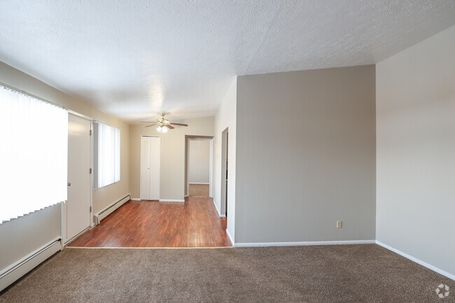 1BR, 1BA - 700SF - Living Room and Dining Area - Pinecrest Apartments