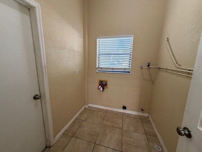 Photo - Spacious Open-Concept Home with Bonus Patio & Fenced Yard