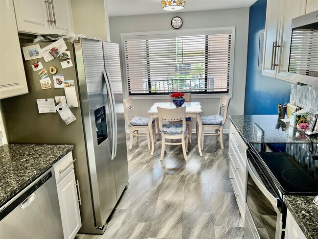 Building Photo - 9787 N Belfort Cir Unit 307