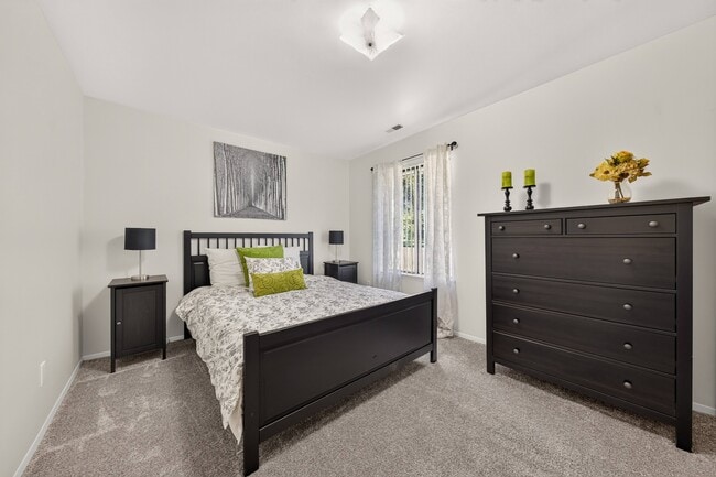 Modern bedroom with ample storage space at Eastwood Village Apartments in Clinton Township, MI.
