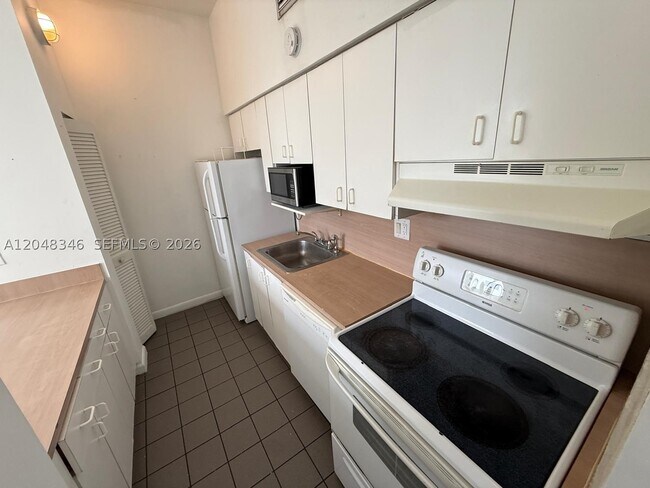 Building Photo - 7400 W 20th Ave Unit 420