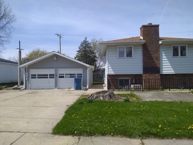 Side of house and garage and parking