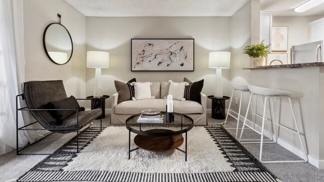 Featuring an open layout, neutral finishes, and convenient bar seating, this welcoming area is ideal for gathering with friends or enjoying a quiet evening at home.