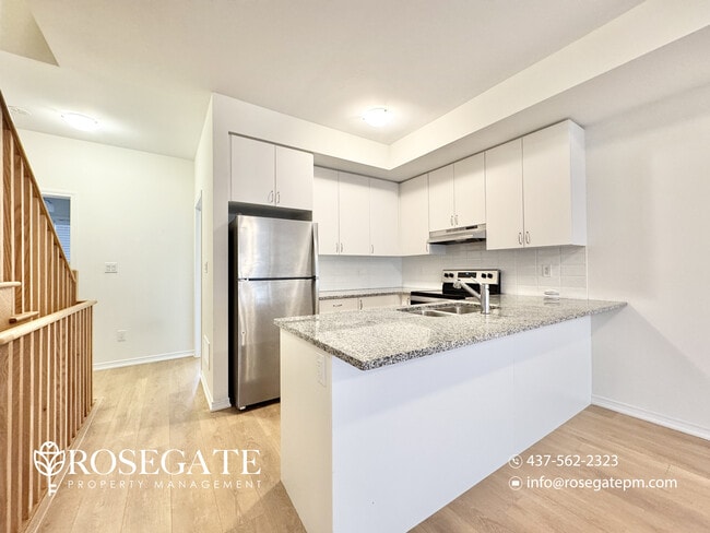 Photo - Massive 5-Bedroom + Den Townhouse with Garage & Deck in Oshawa