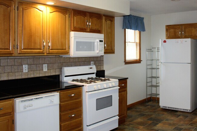 Kitchen with gas range and over the range microwave - 78 Elm St
