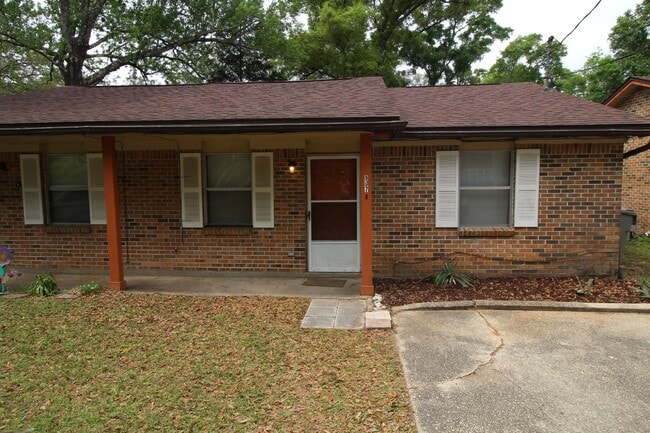 Building Photo - Brick Duplex Near NAS Pensacola & Corry Station with Tile Flooring Throughout and Fully Fenced Ba... Unit B