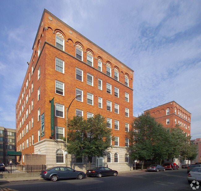 Museum Park apartment community exterior featuring historic brick architecture and urban living