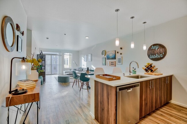 Spacious living and dining area filled with natural light - The Whittaker