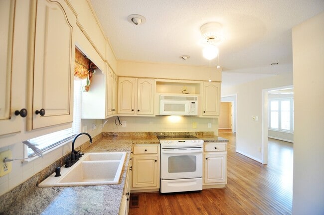 Photo - Large home with a pool.