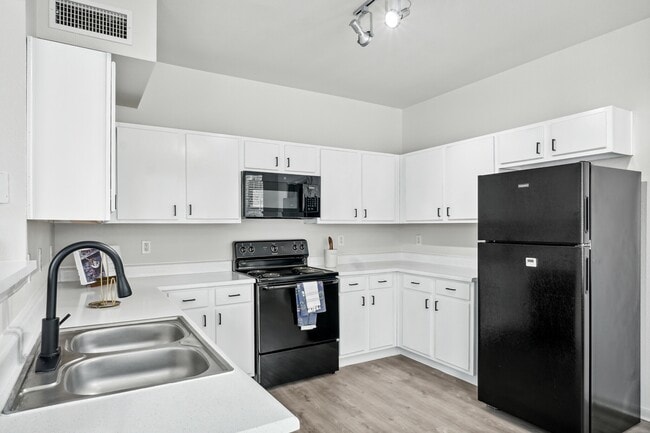 Spacious Kitchen with Black Appliances