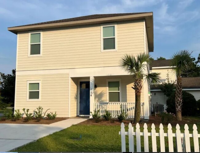 Front elevation with the evening sunset! - 114 Enchanted Way House