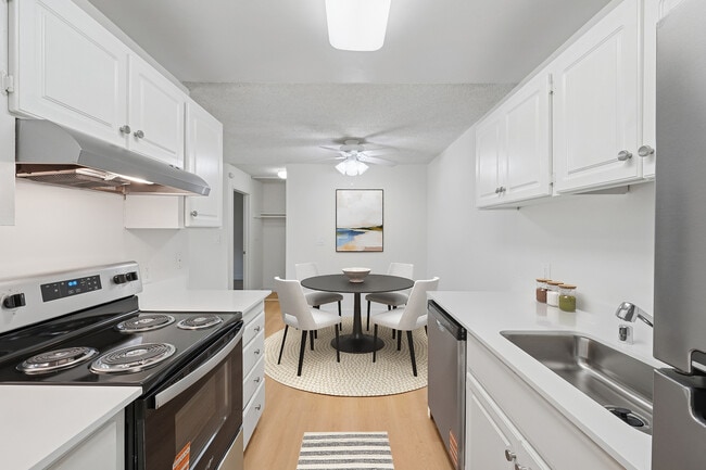 Renovated Package I kitchen and dining area with hard surface flooring - eaves Foster City